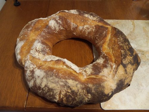 A just-baked-before-lunch Tuscan bread ring 0 still hot when we picked it up at Mazzaro's bakery counter.